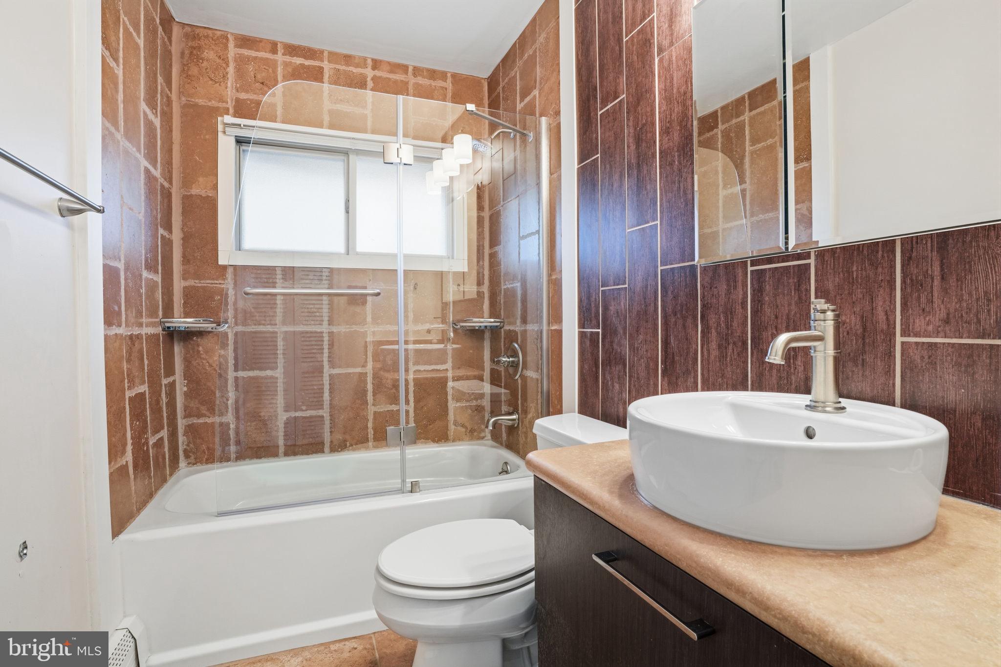80 Silverspruce Road Levittown, PA 19056 - Photo 19 of 31 a bathroom with a sink toilet and shower