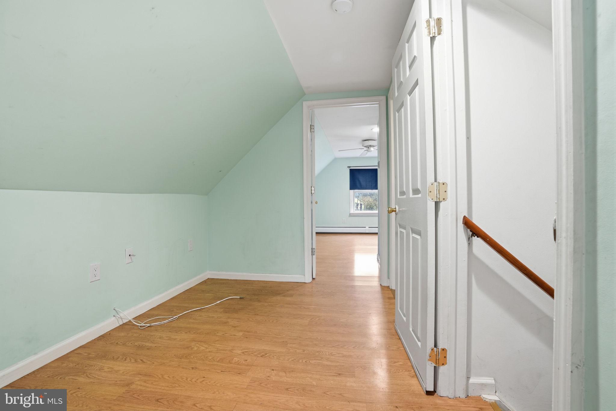 80 Silverspruce Road Levittown, PA 19056 - Photo 22 of 31 a view of empty room with wooden floor