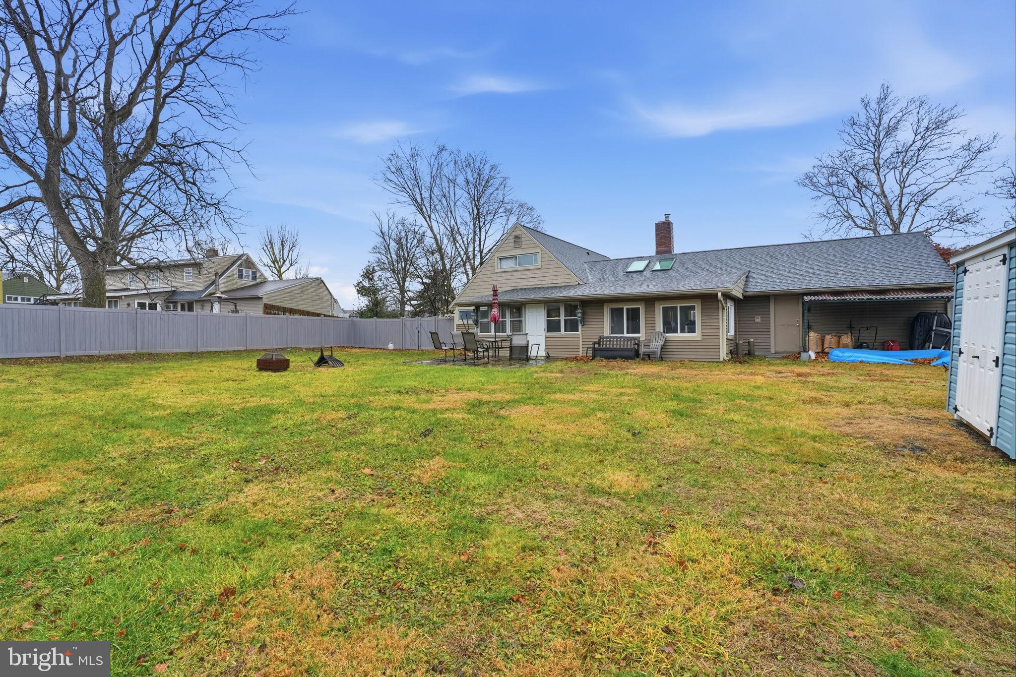 80 Silverspruce Road Levittown, PA 19056 - Photo 27 of 31 a view of a house with a big yard and large trees