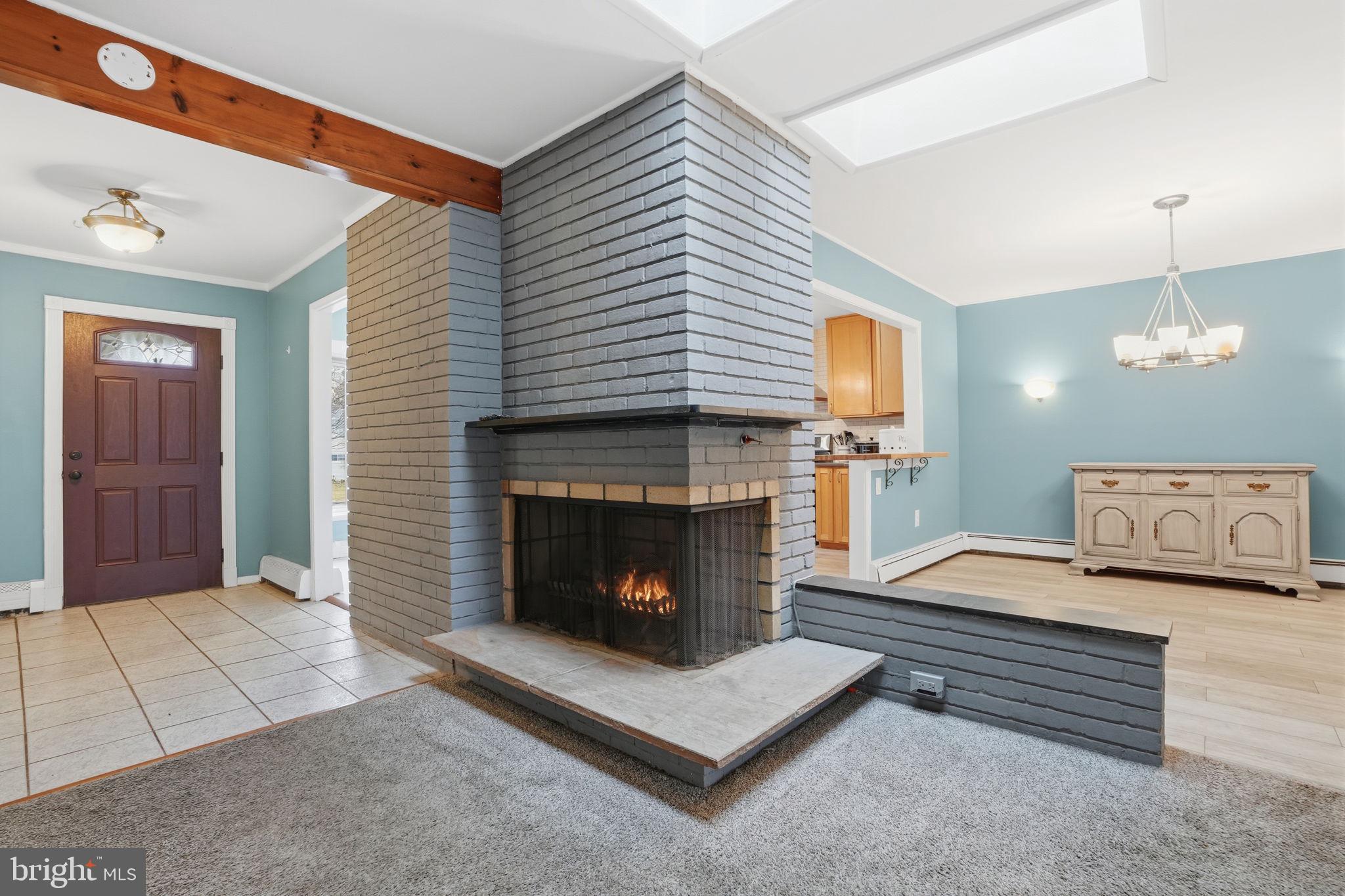 80 Silverspruce Road Levittown, PA 19056 - Photo 3 of 31 a living room with furniture and a fireplace