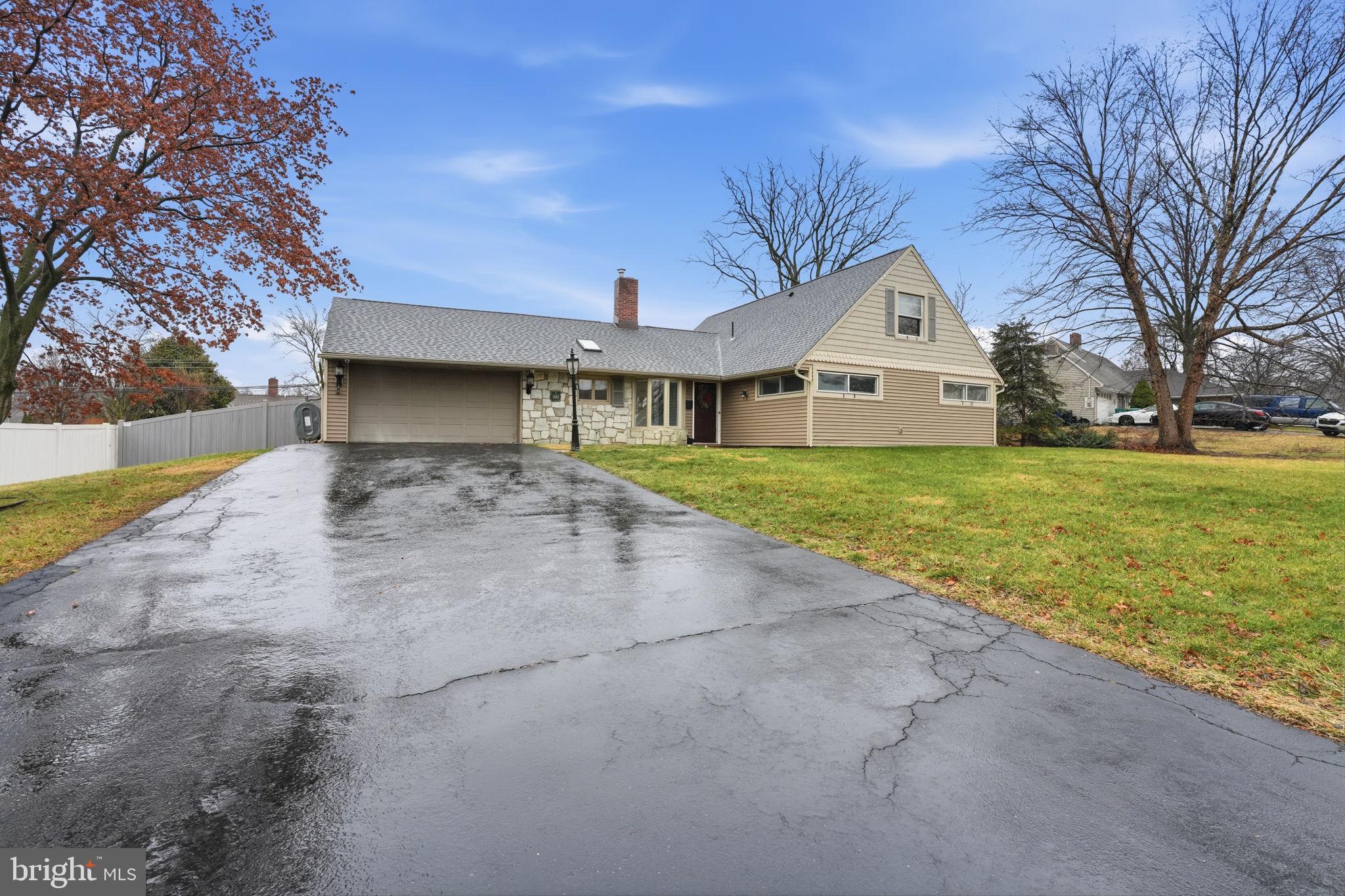 80 Silverspruce Road Levittown, PA 19056 - Photo 31 of 31 a front view of a house with a yard and garage
