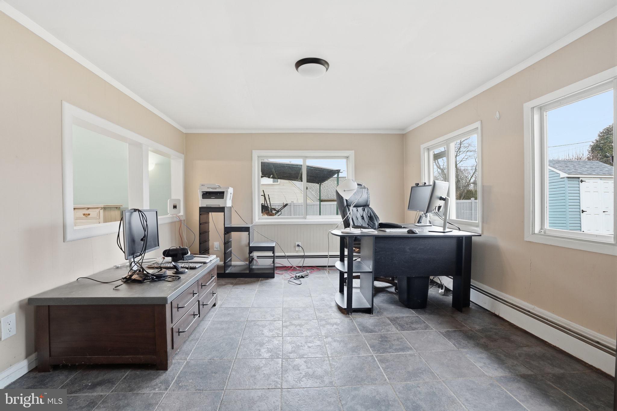 80 Silverspruce Road Levittown, PA 19056 - Photo 7 of 31 a view of a workspace with furniture and a window