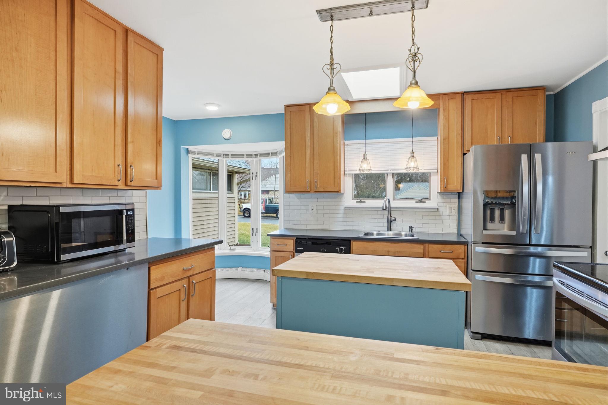 80 Silverspruce Road Levittown, PA 19056 - Photo 9 of 31 a kitchen with stainless steel appliances granite countertop a stove and a refrigerator