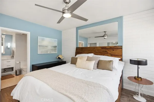 a bedroom with a bed and a desk