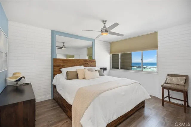 a bathroom with a granite countertop shower sink and mirror