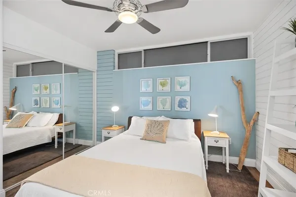 a bedroom with a bed and a closet