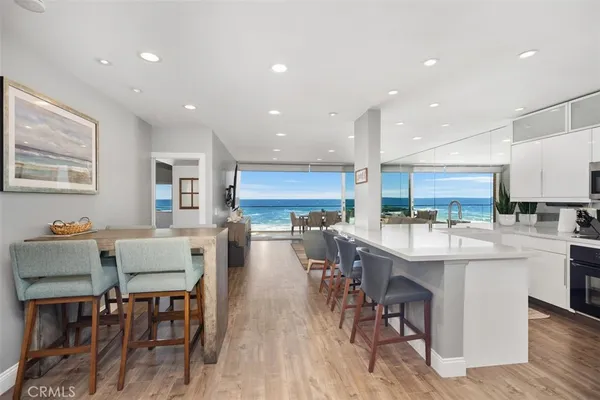 a view of a kitchen with kitchen island a large window in it