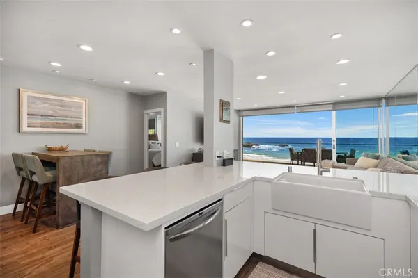 a kitchen with counter top space cabinets and stainless steel appliances