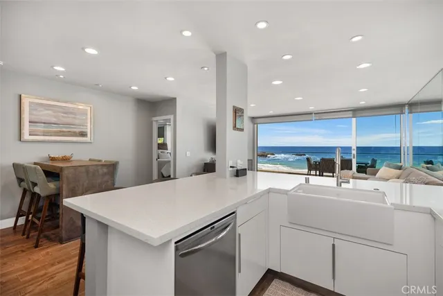 a kitchen with counter top space cabinets and stainless steel appliances