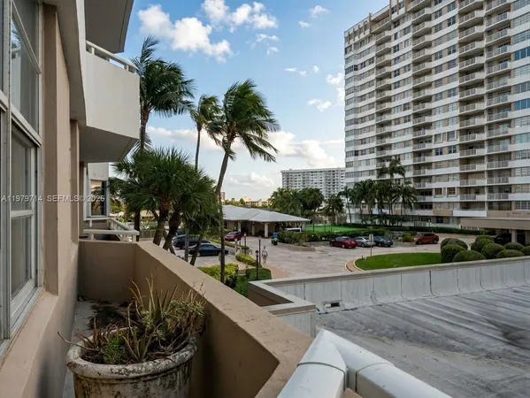 a view of a swimming pool with a patio and a tub