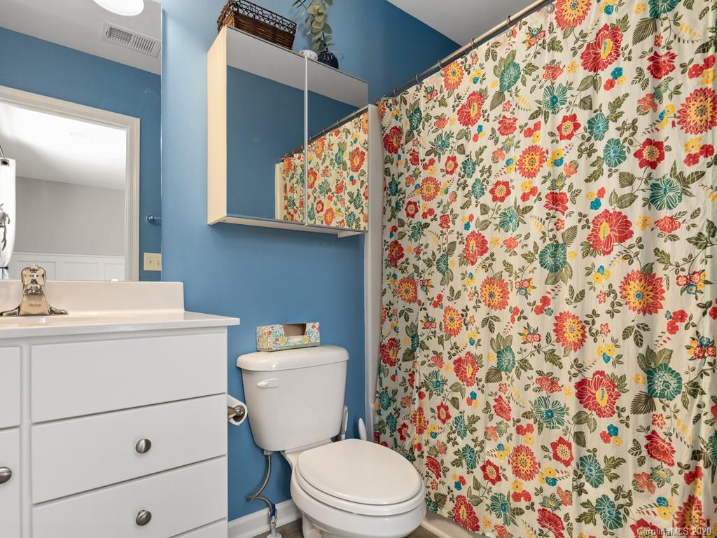 21 North River Road Fletcher, NC 28732 - Photo 11 of 19 a bathroom with a toilet and a sink