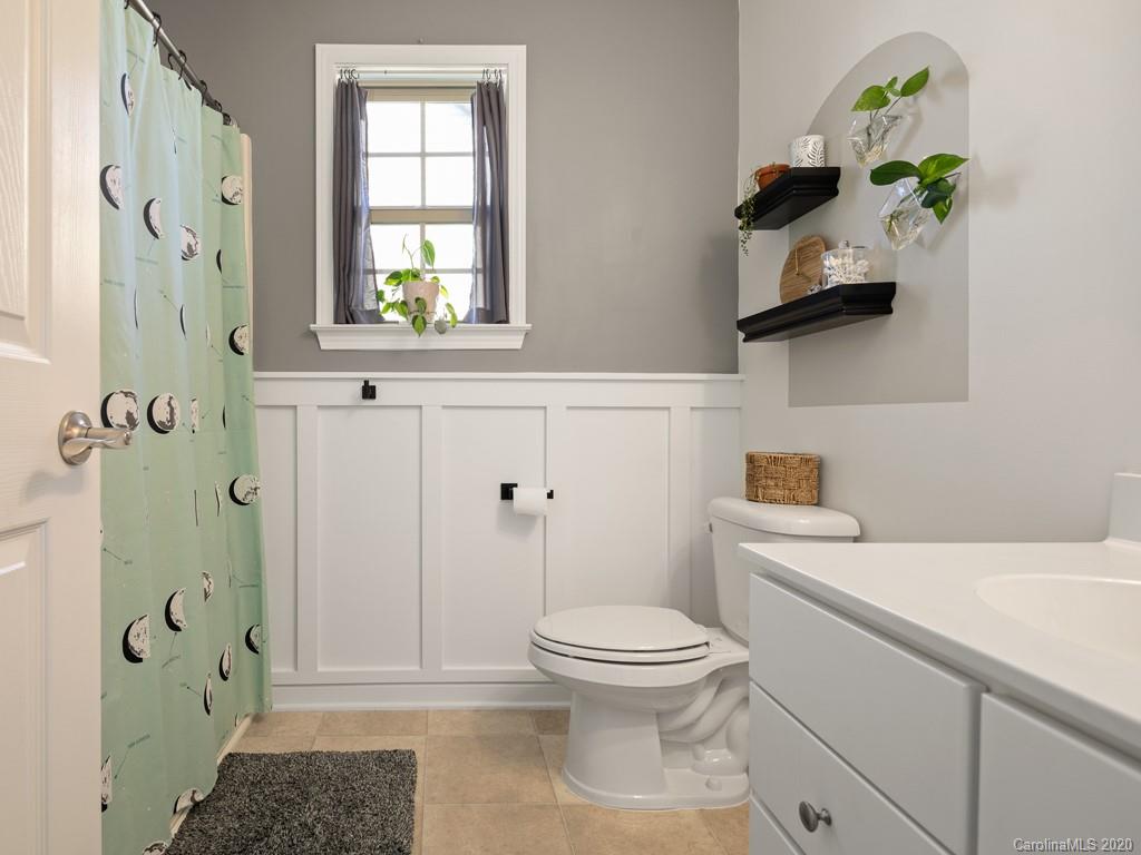 21 North River Road Fletcher, NC 28732 - Photo 15 of 19 a bathroom with a sink toilet and shower
