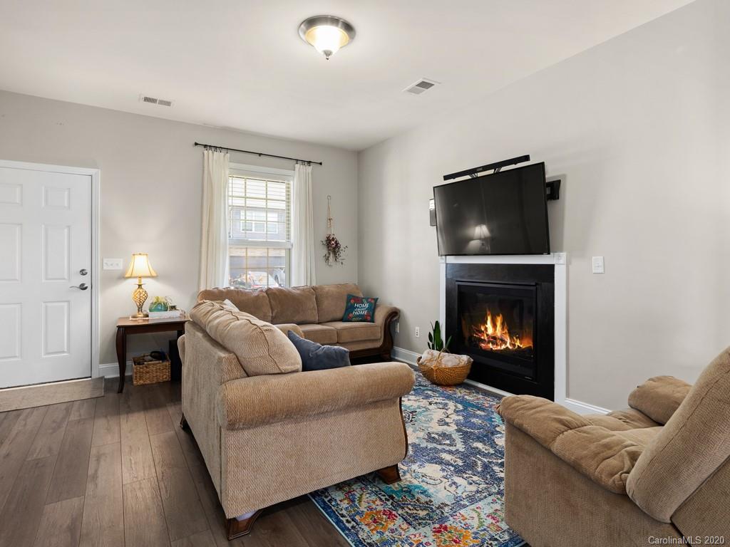 21 North River Road Fletcher, NC 28732 - Photo 4 of 19 a living room with furniture and a fireplace