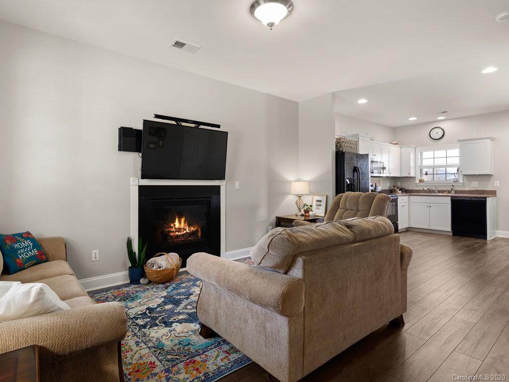 21 North River Road Fletcher, NC 28732 - Photo 5 of 19 a living room with furniture and a fireplace