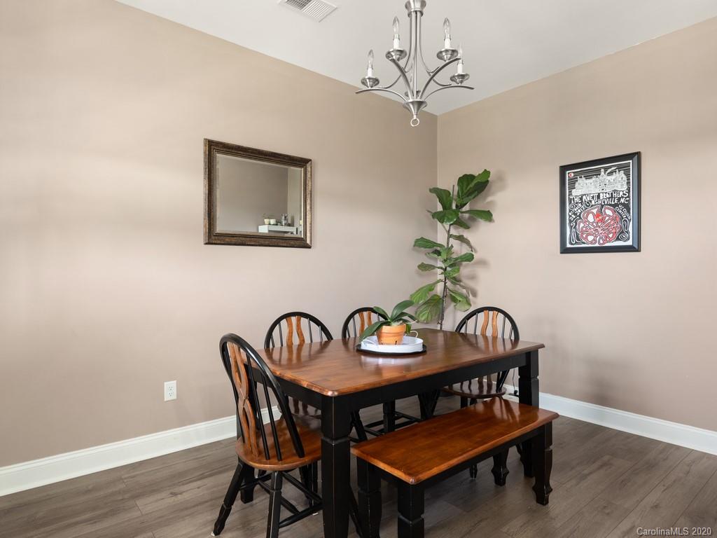 21 North River Road Fletcher, NC 28732 - Photo 8 of 19 a view of a dining room with furniture wooden floor and a chandelier