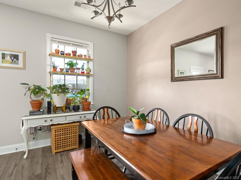 21 North River Road Fletcher, NC 28732 - Photo 9 of 19 a view of a dining room with furniture window and wooden floor