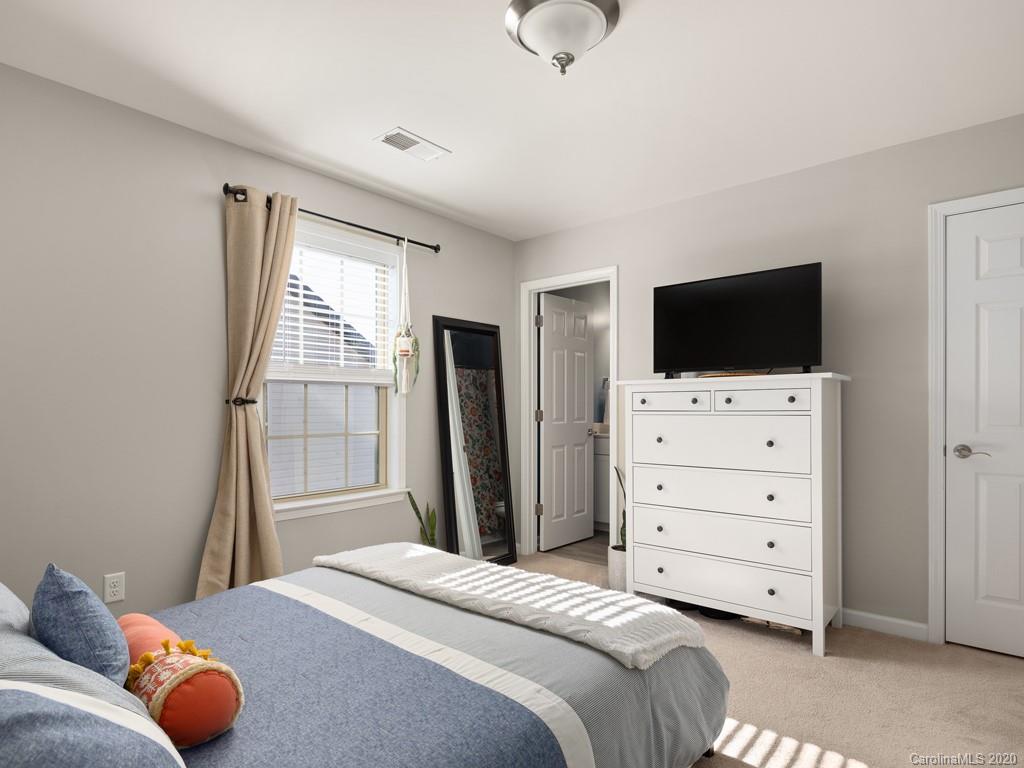 21 North River Road Fletcher, NC 28732 - Photo 10 of 19 a bedroom with a bed and a flat screen tv