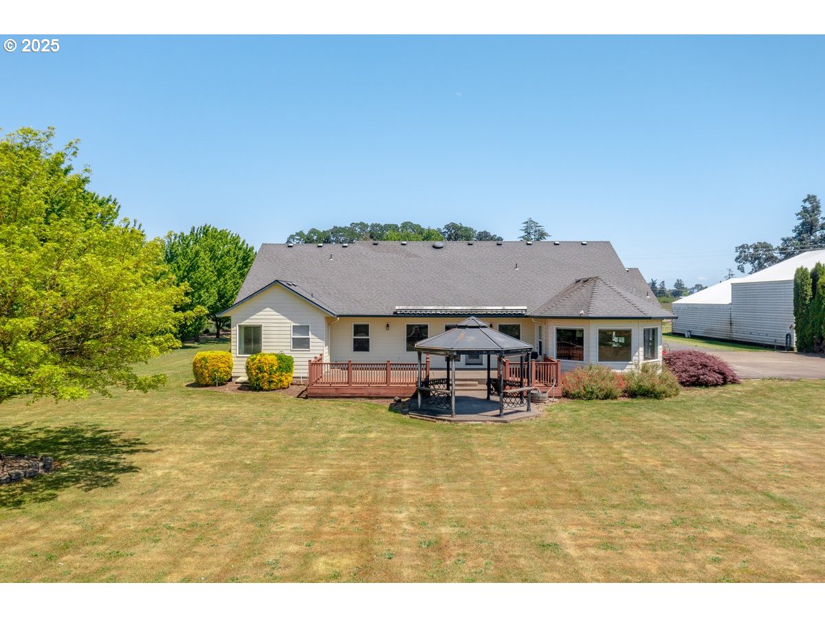 17780 Southeast Wallace Road Dayton, OR 97114 - Photo 3 of 26 a view of a house with patio next to a yard
