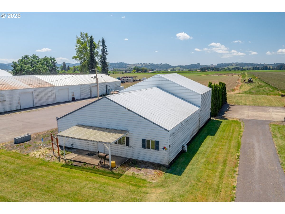 17780 Southeast Wallace Road Dayton, OR 97114 - Photo 5 of 26 a aerial view of a house with swimming pool and large trees