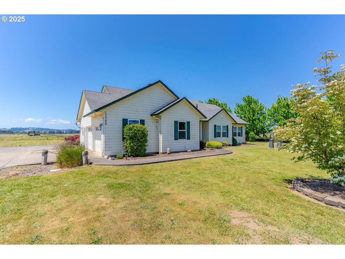 17780 Southeast Wallace Road Dayton, OR 97114 - Photo 9 of 26 a view of a house with backyard and garden