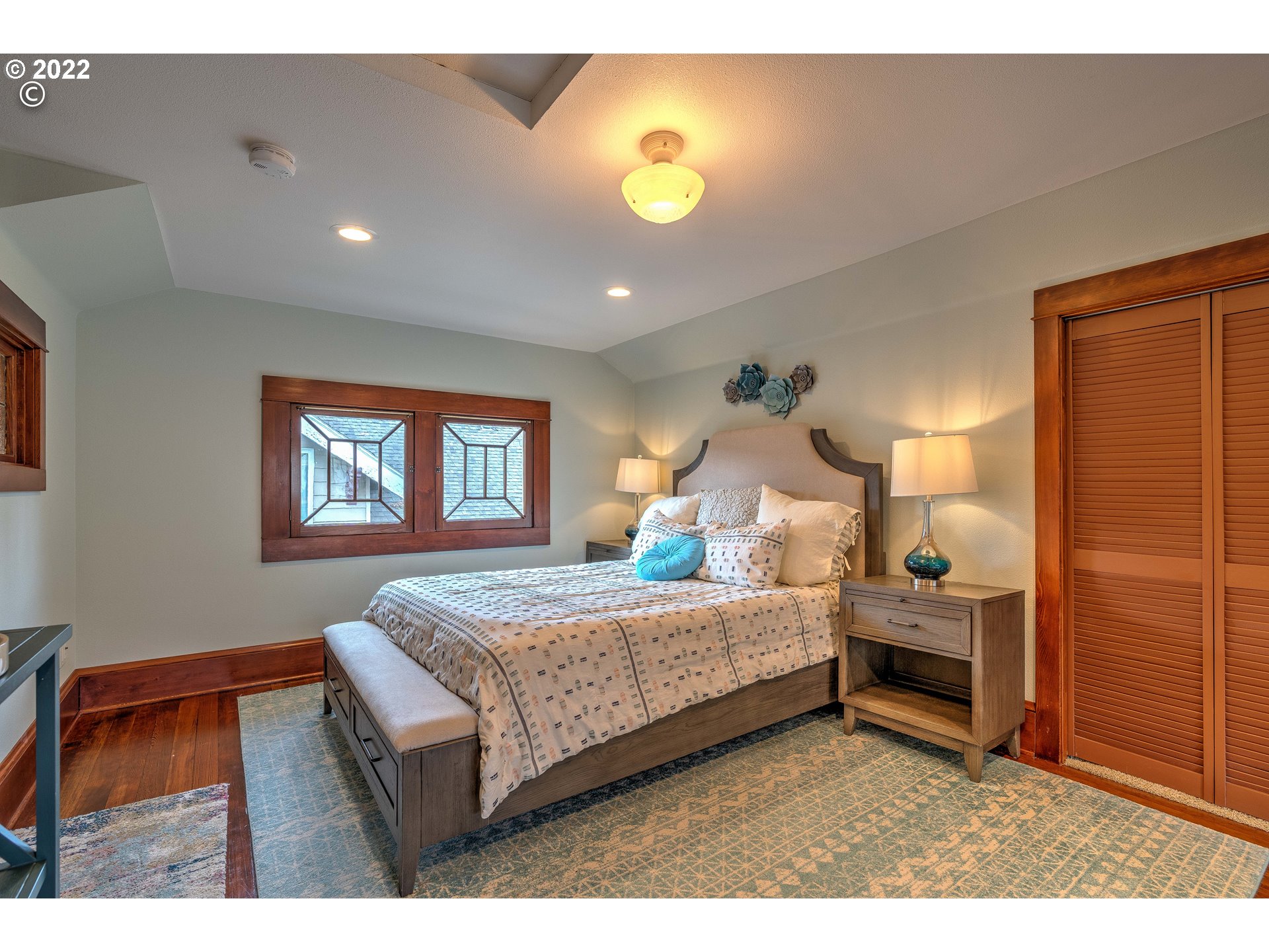 1824 Northeast 53rd Avenue Portland, OR 97213 - Photo 16 of 32 a bedroom with a bed and a lamp