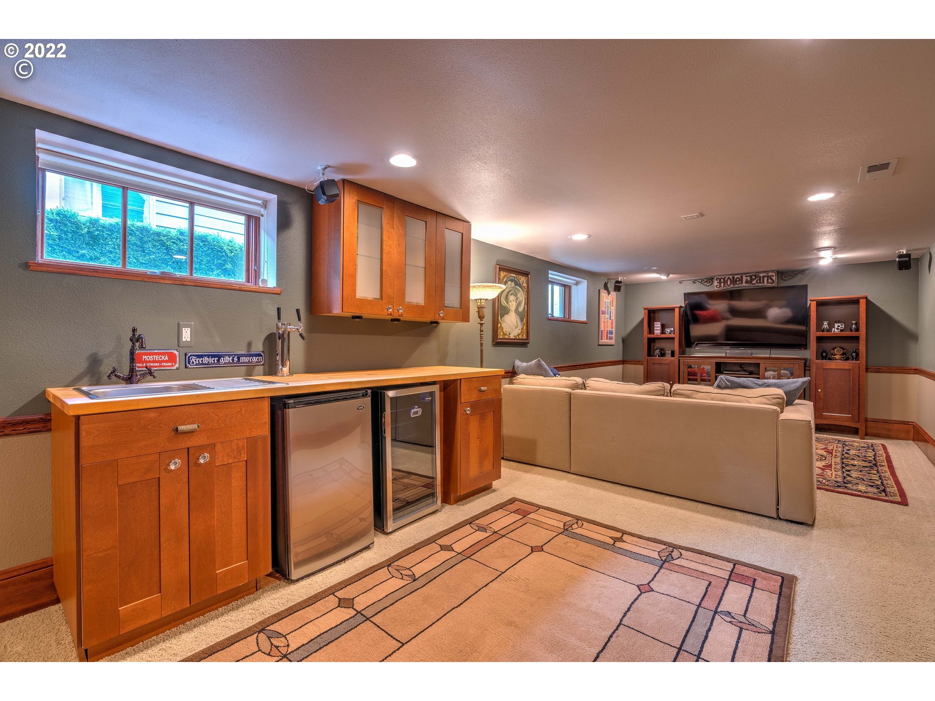 1824 Northeast 53rd Avenue Portland, OR 97213 - Photo 20 of 32 a kitchen with stainless steel appliances granite countertop a refrigerator a stove a sink dishwasher and wooden cabinets with wooden floor