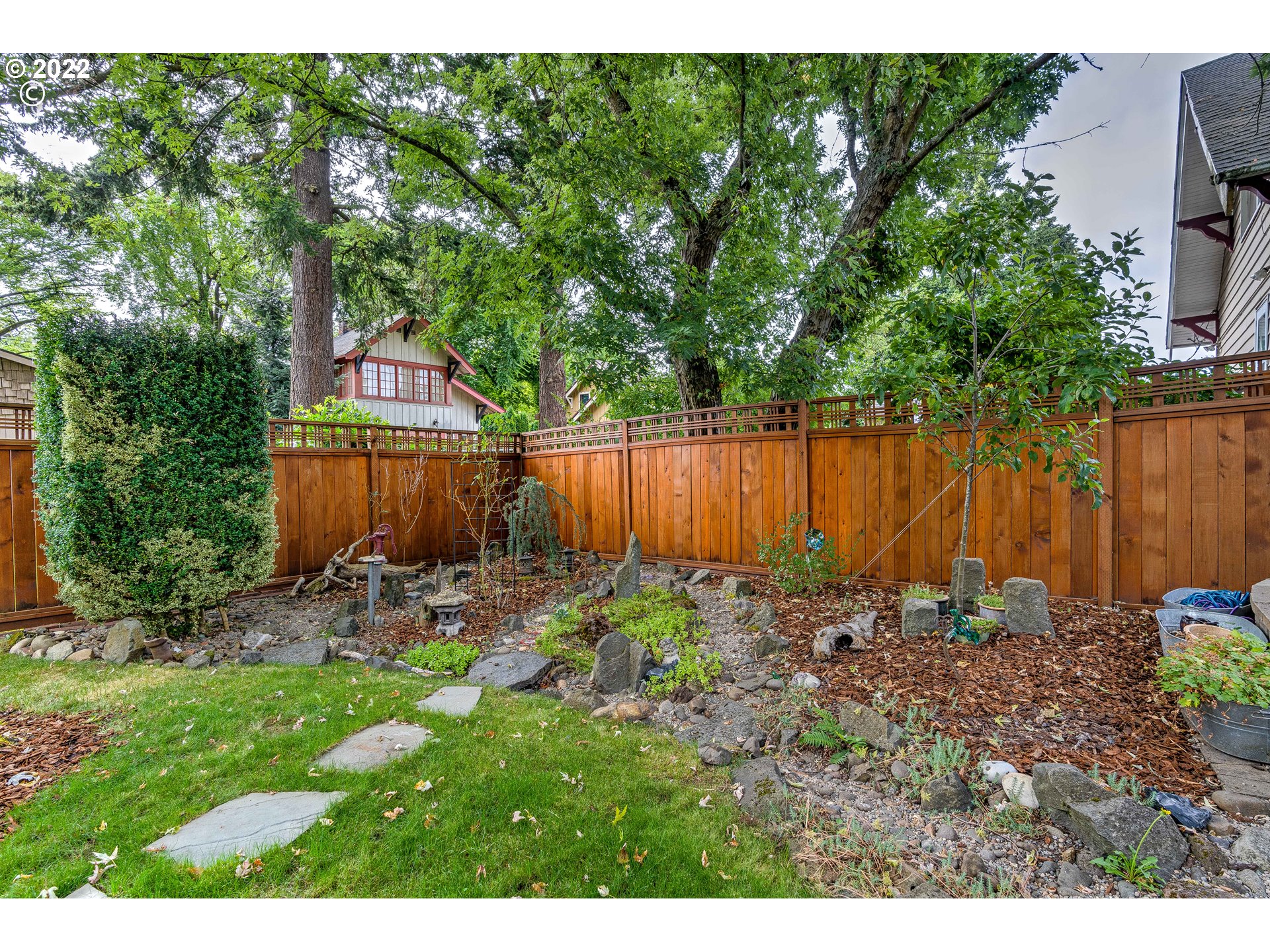 1824 Northeast 53rd Avenue Portland, OR 97213 - Photo 29 of 32 a backyard of a house with lots of green space