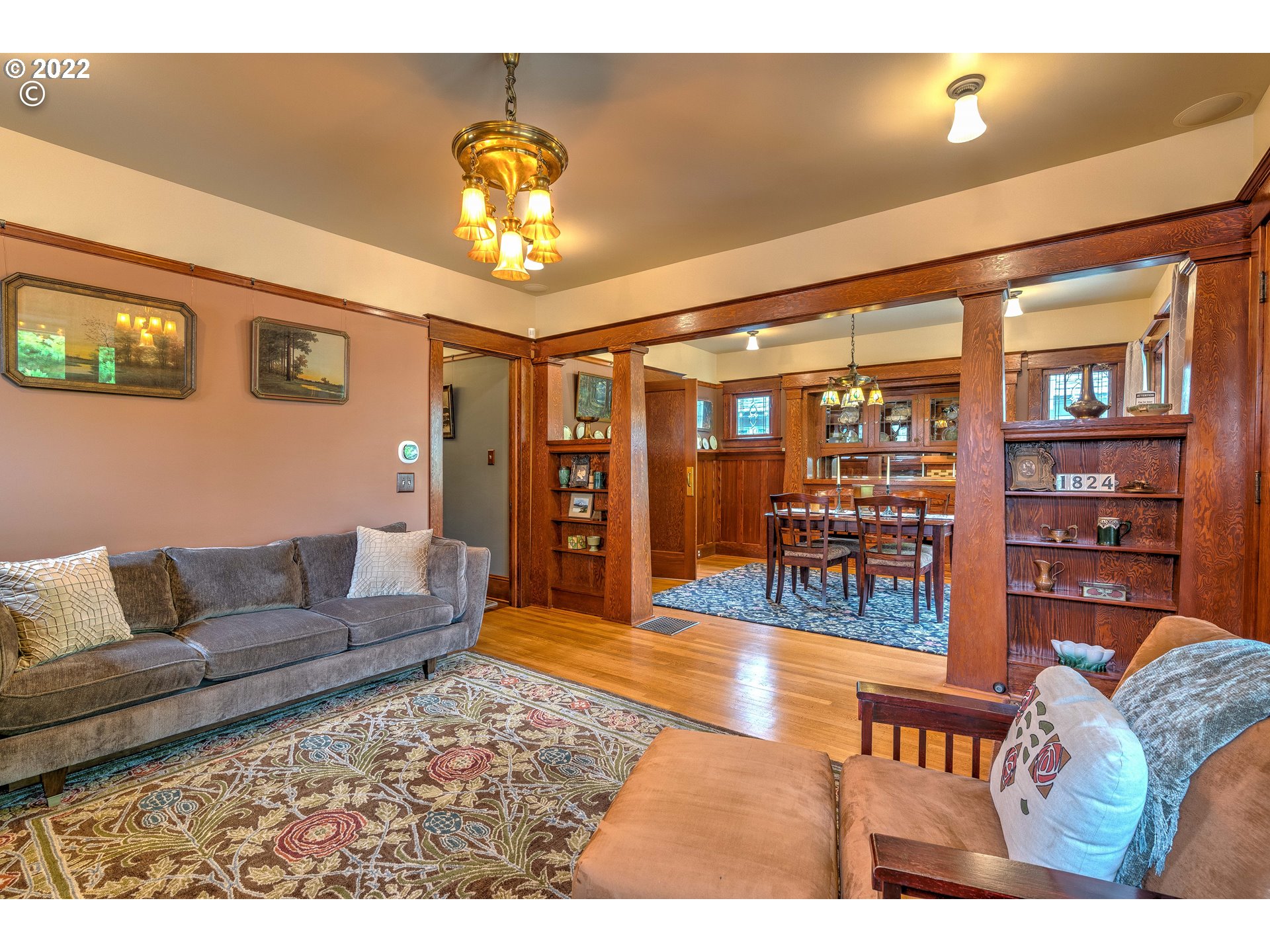 1824 Northeast 53rd Avenue Portland, OR 97213 - Photo 5 of 32 a living room with furniture a chandelier and a dining table