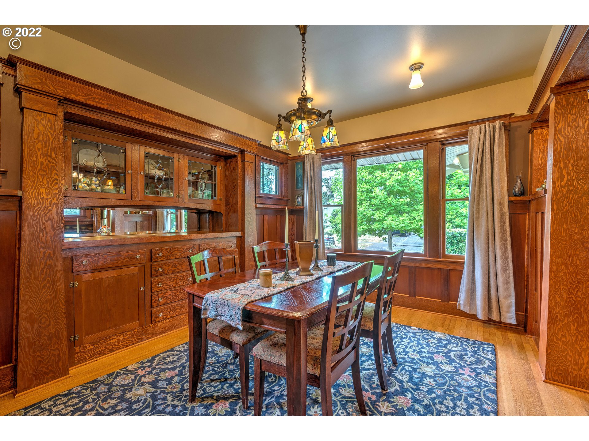 1824 Northeast 53rd Avenue Portland, OR 97213 - Photo 7 of 32 a dining room with furniture a chandelier and window