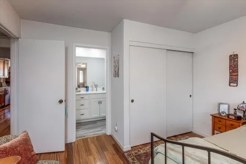 a bathroom with a sink a mirror and a toilet