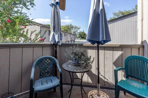 a table and chairs in a patio
