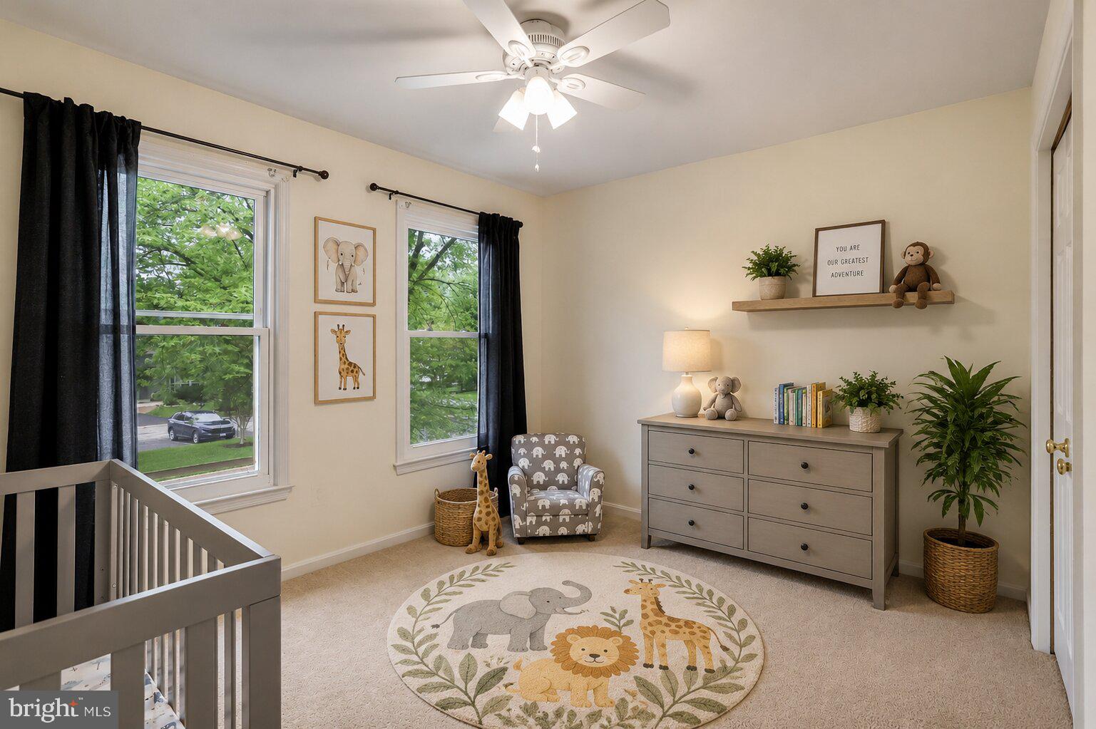 17303 Buehler Road Olney, MD 20832 - Photo 9 of 14 a spacious bedroom with a bed and a window