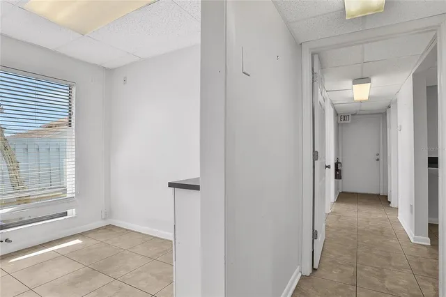 a work room with furniture and wooden floor