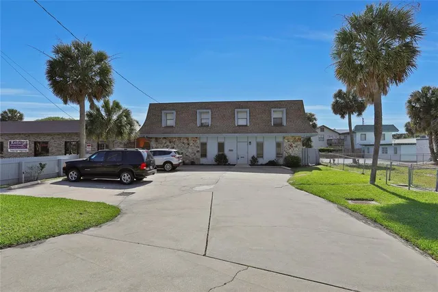 an aerial view of a house with a yard and pool table