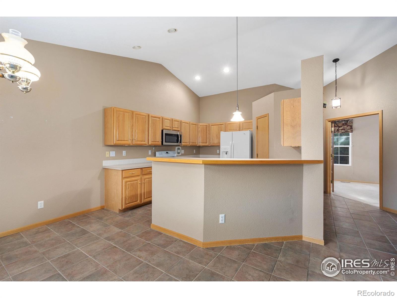 2656 Paddington Road Fort Collins, CO 80525 - Photo 12 of 50 a view of kitchen with cabinets and wooden floor