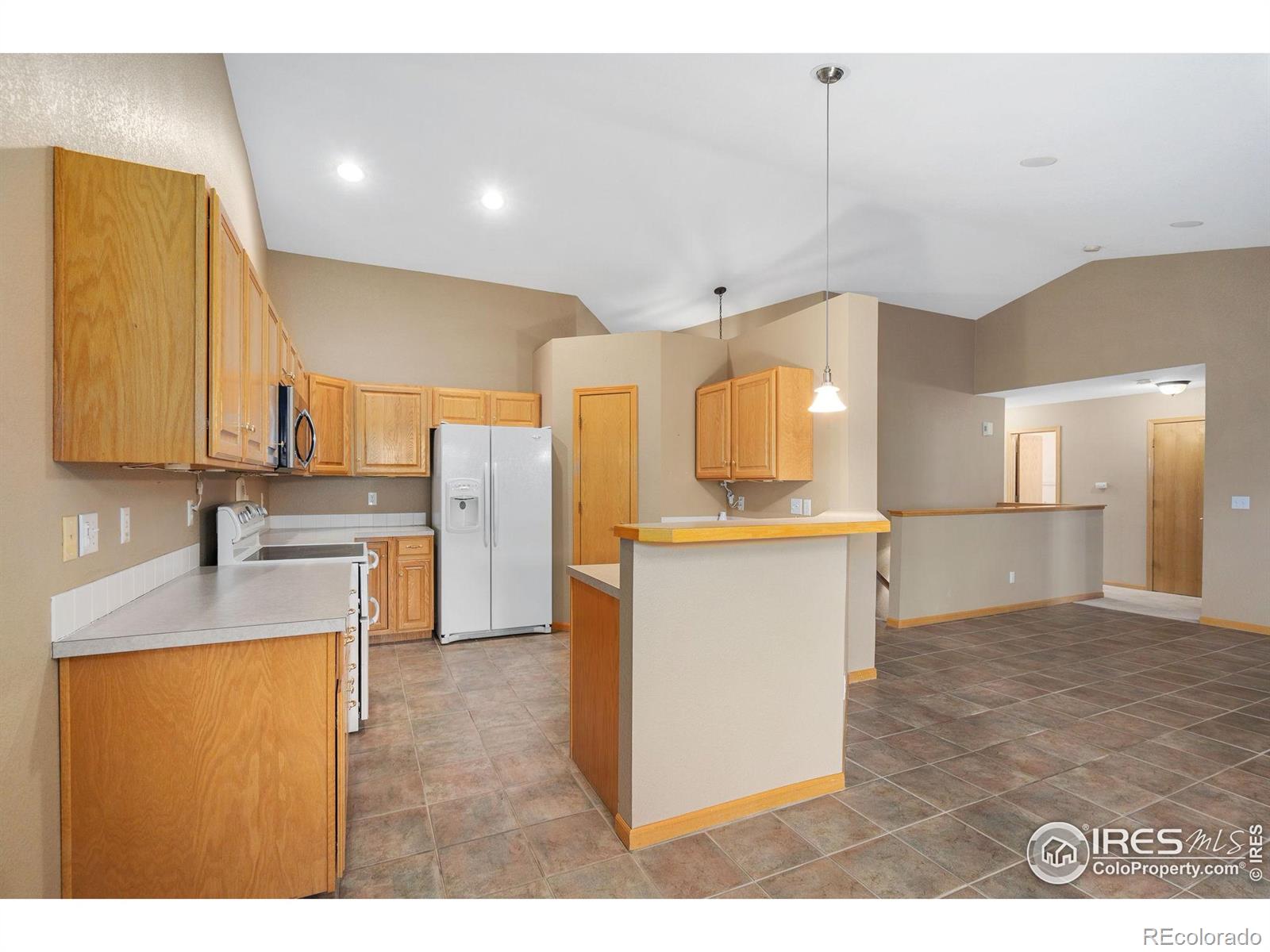 2656 Paddington Road Fort Collins, CO 80525 - Photo 15 of 50 a kitchen with a refrigerator sink and cabinets