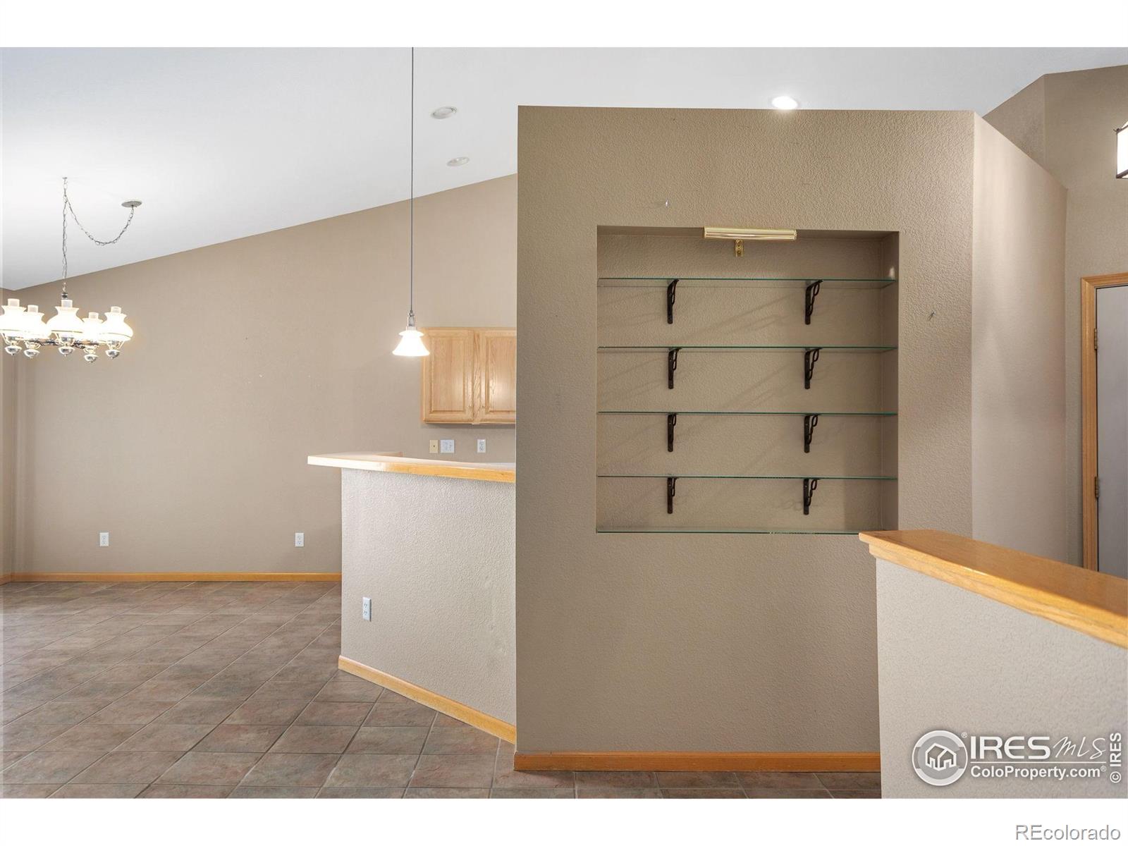 2656 Paddington Road Fort Collins, CO 80525 - Photo 18 of 50 a view of a kitchen with cabinet and stairs