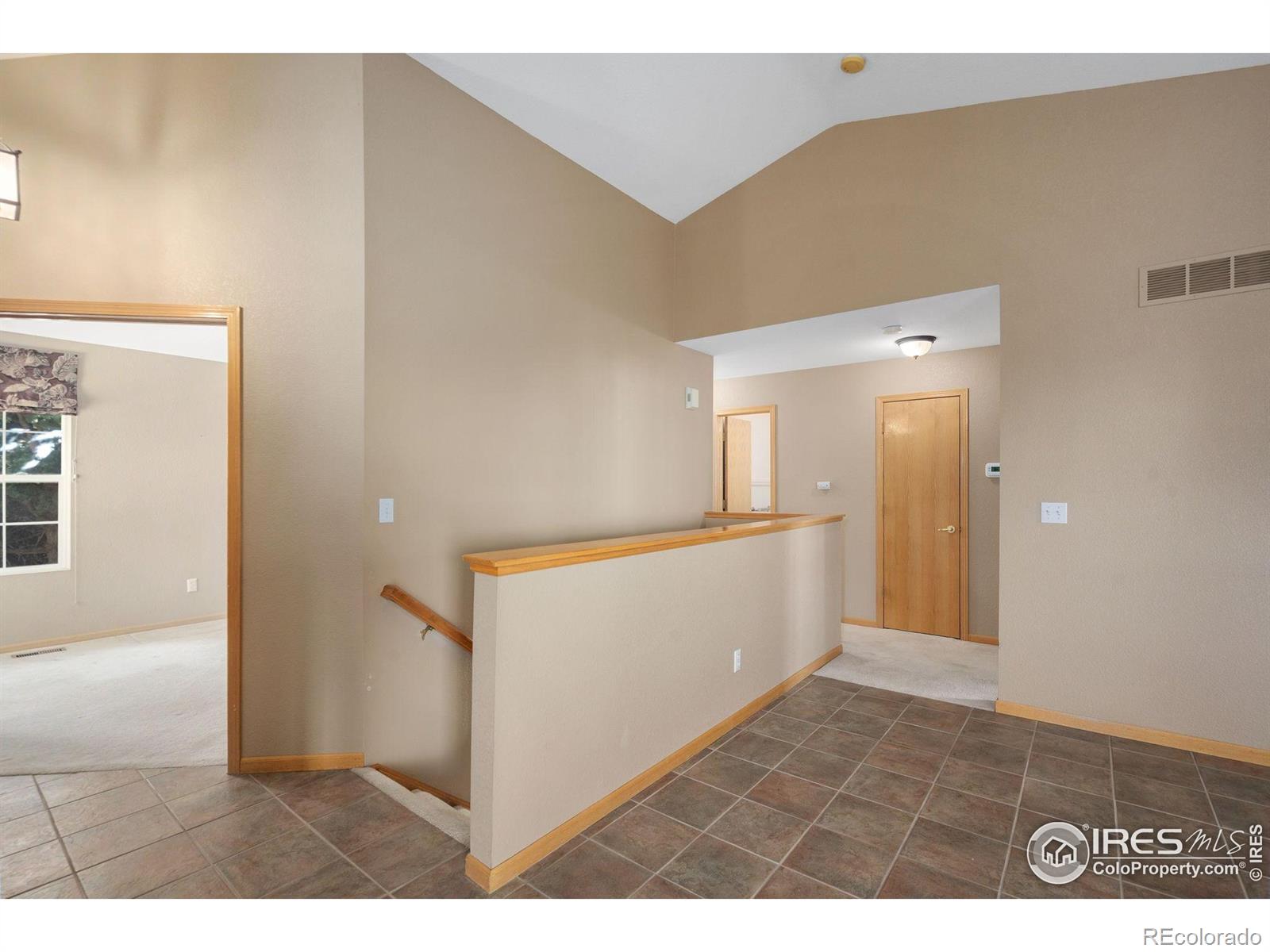 2656 Paddington Road Fort Collins, CO 80525 - Photo 19 of 50 a view of a hallway with an empty room