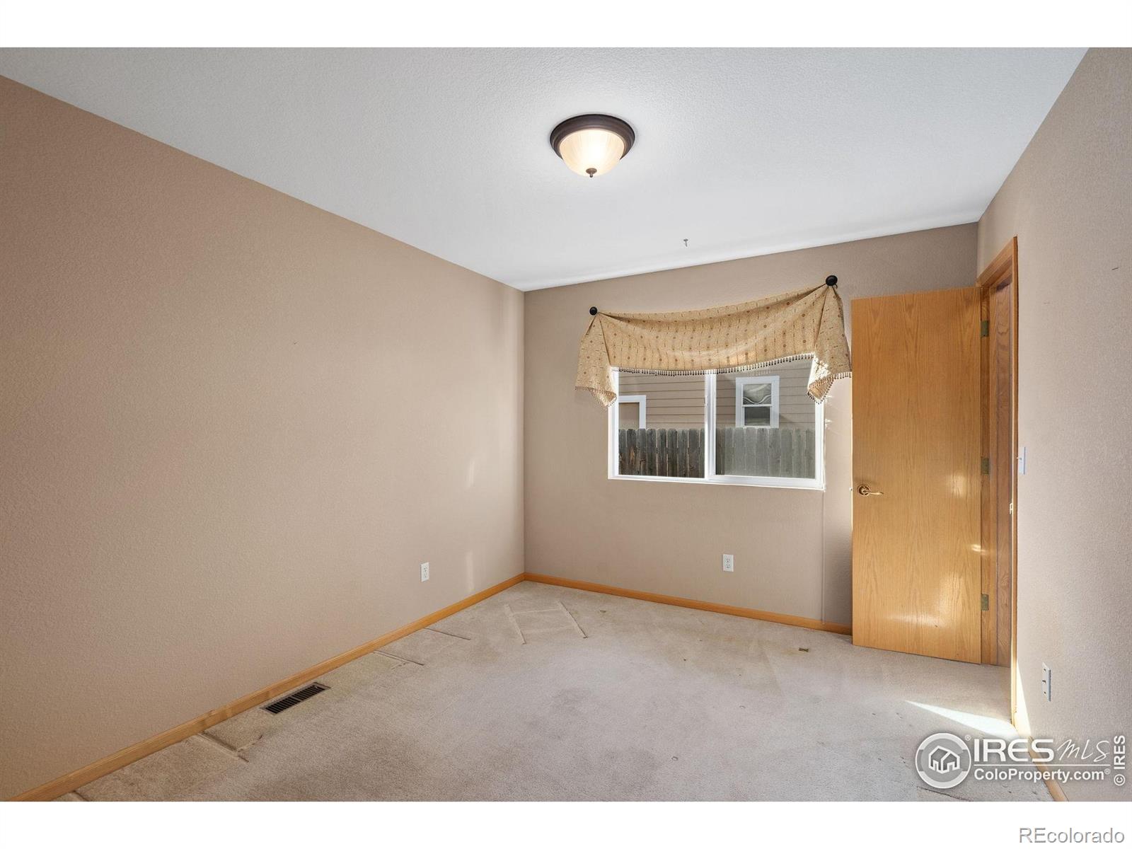 2656 Paddington Road Fort Collins, CO 80525 - Photo 25 of 50 a view of an empty room with a window
