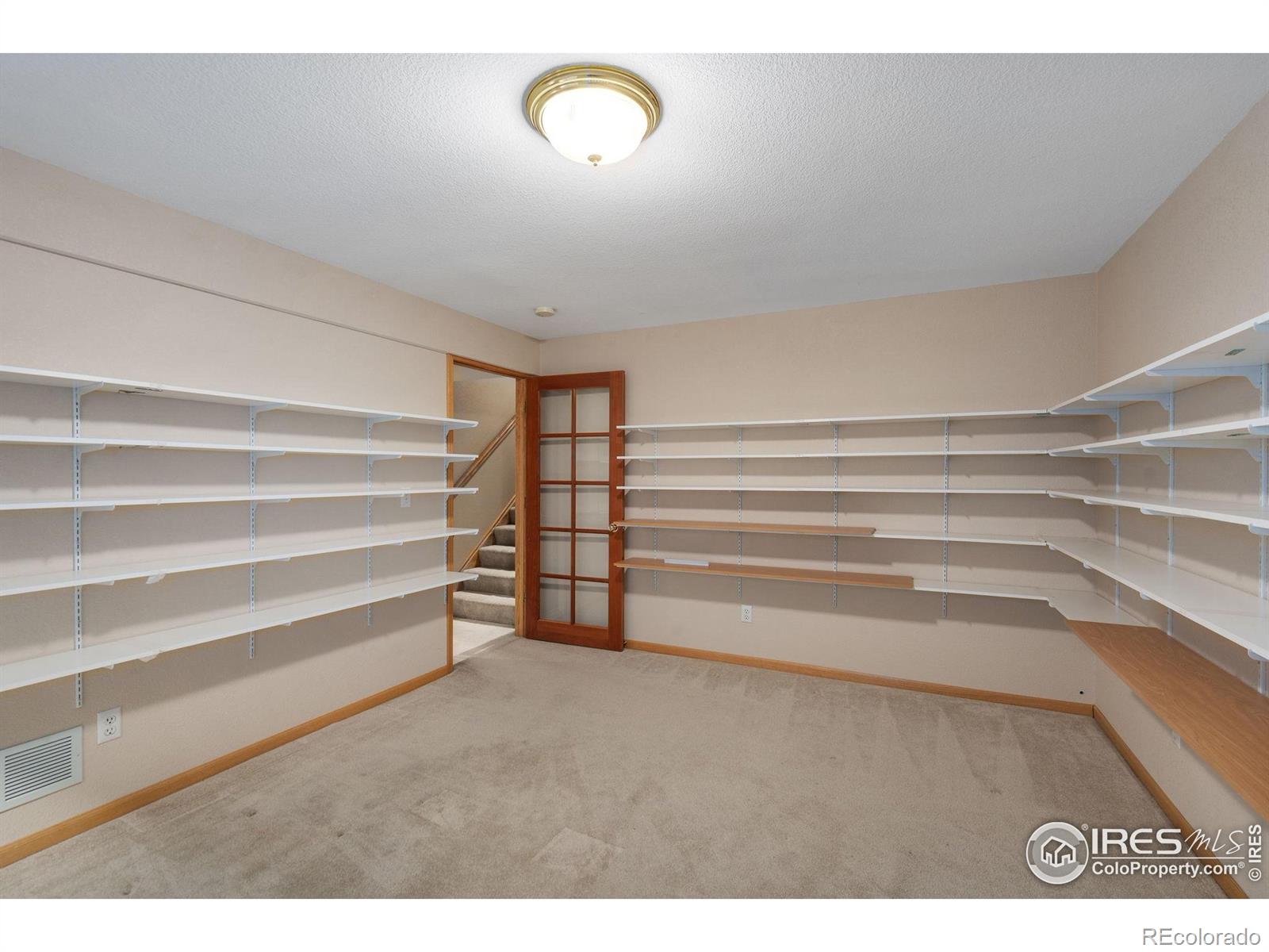 2656 Paddington Road Fort Collins, CO 80525 - Photo 31 of 50 a view of room with stairs and a closet