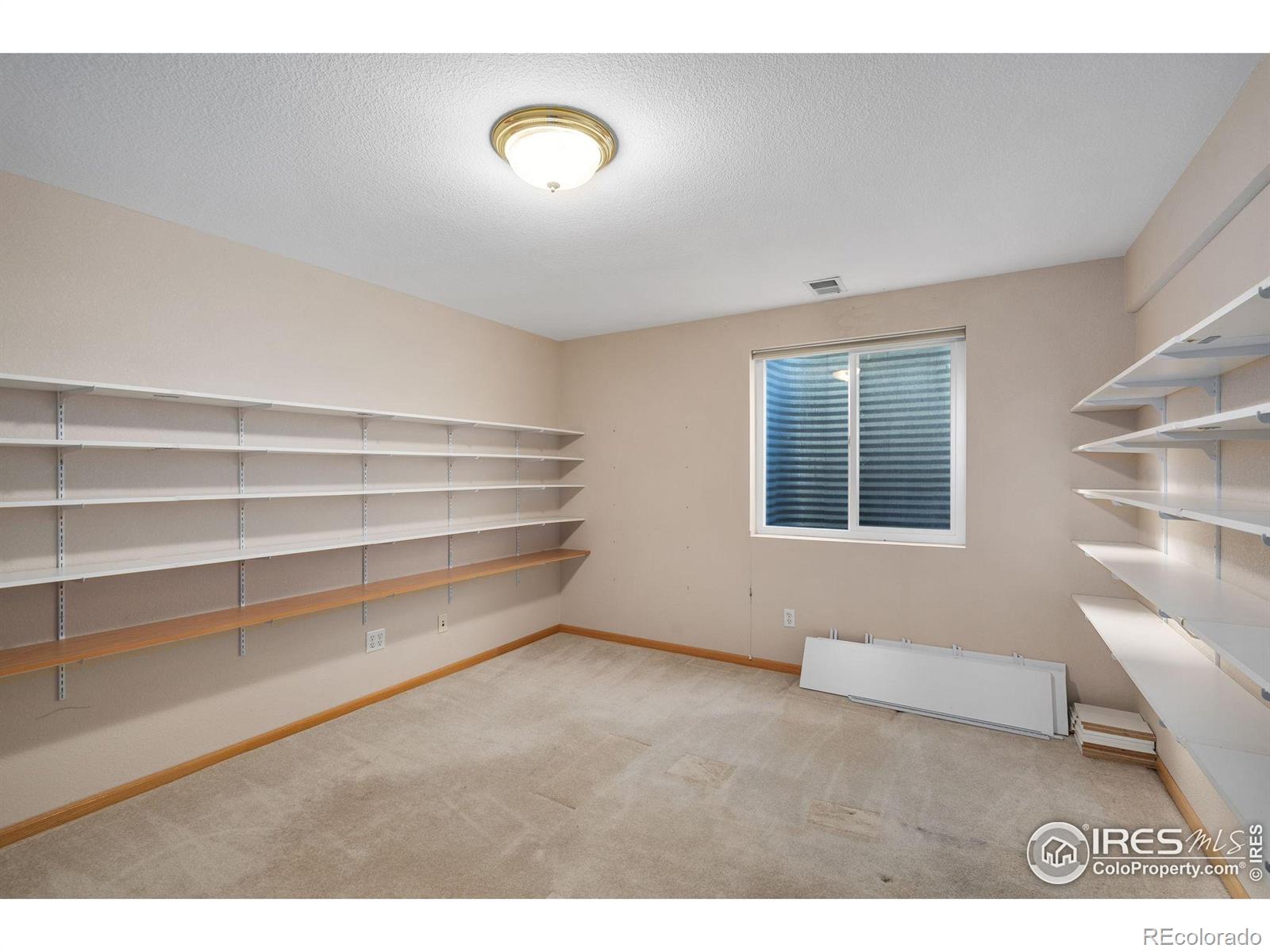 2656 Paddington Road Fort Collins, CO 80525 - Photo 32 of 50 a view of an empty room with a window