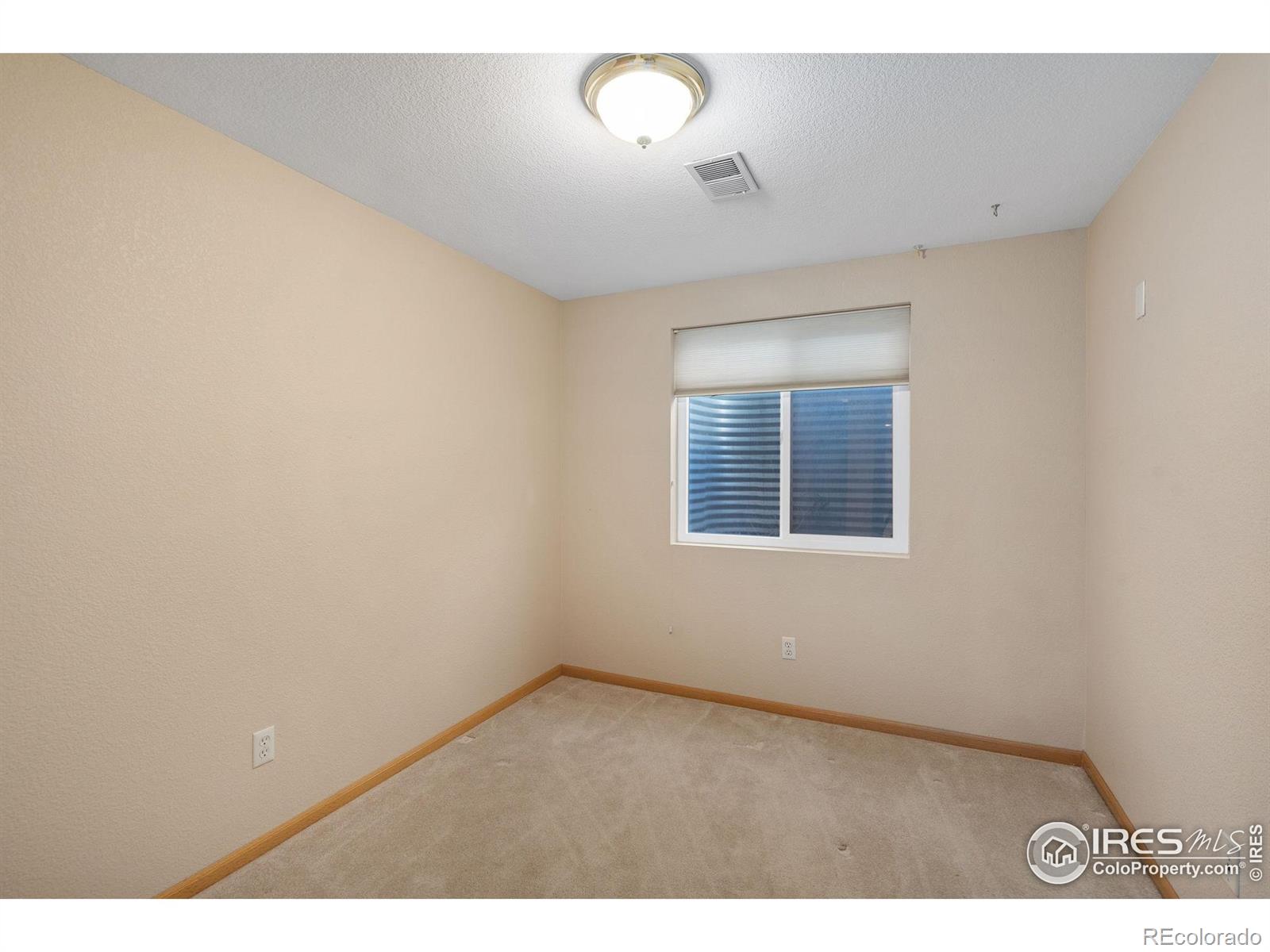 2656 Paddington Road Fort Collins, CO 80525 - Photo 38 of 50 a view of an empty room with a window