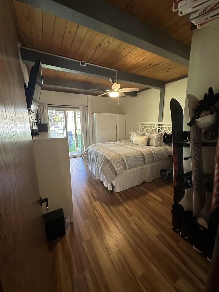 3252 Chateau Road, Unit 43 Mammoth Lakes, CA 93546 - Photo 13 of 29 Wood-finish flooring, exposed wood beam ceiling, ceiling fan with integrated lighting, built-in stor
