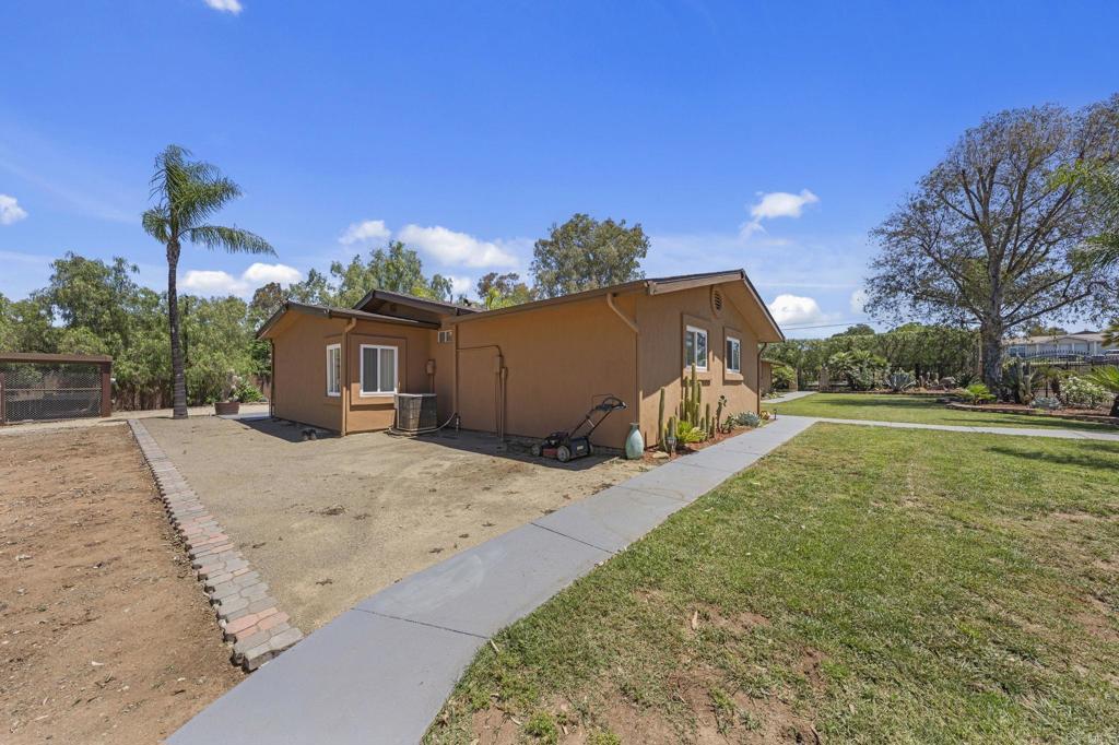 30265 Miller Road Valley Center, CA 92082 - Photo 45 of 56 a view of a house with a yard