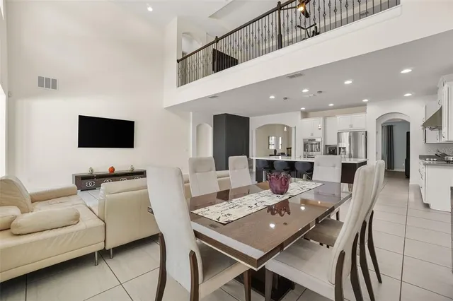 a kitchen with stainless steel appliances kitchen island granite countertop a sink and cabinets