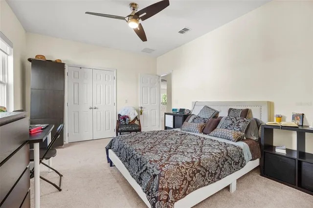 an aerial view of residential houses with outdoor space and river