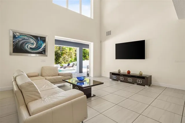 a living room with fireplace furniture and a flat screen tv
