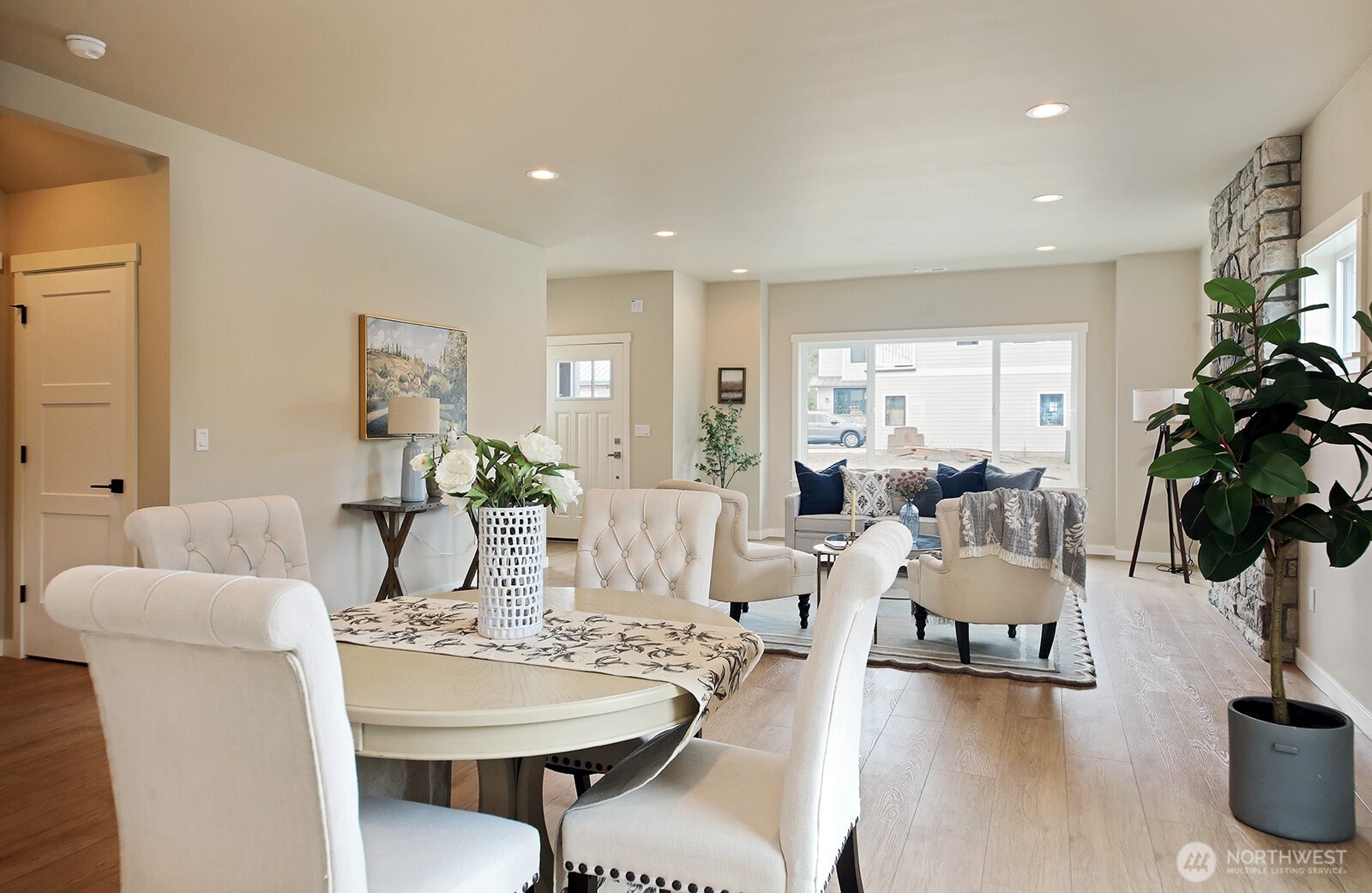 695 3rd Street, Unit A Langley, WA 98260 - Photo 13 of 28 a living room with furniture and flowers