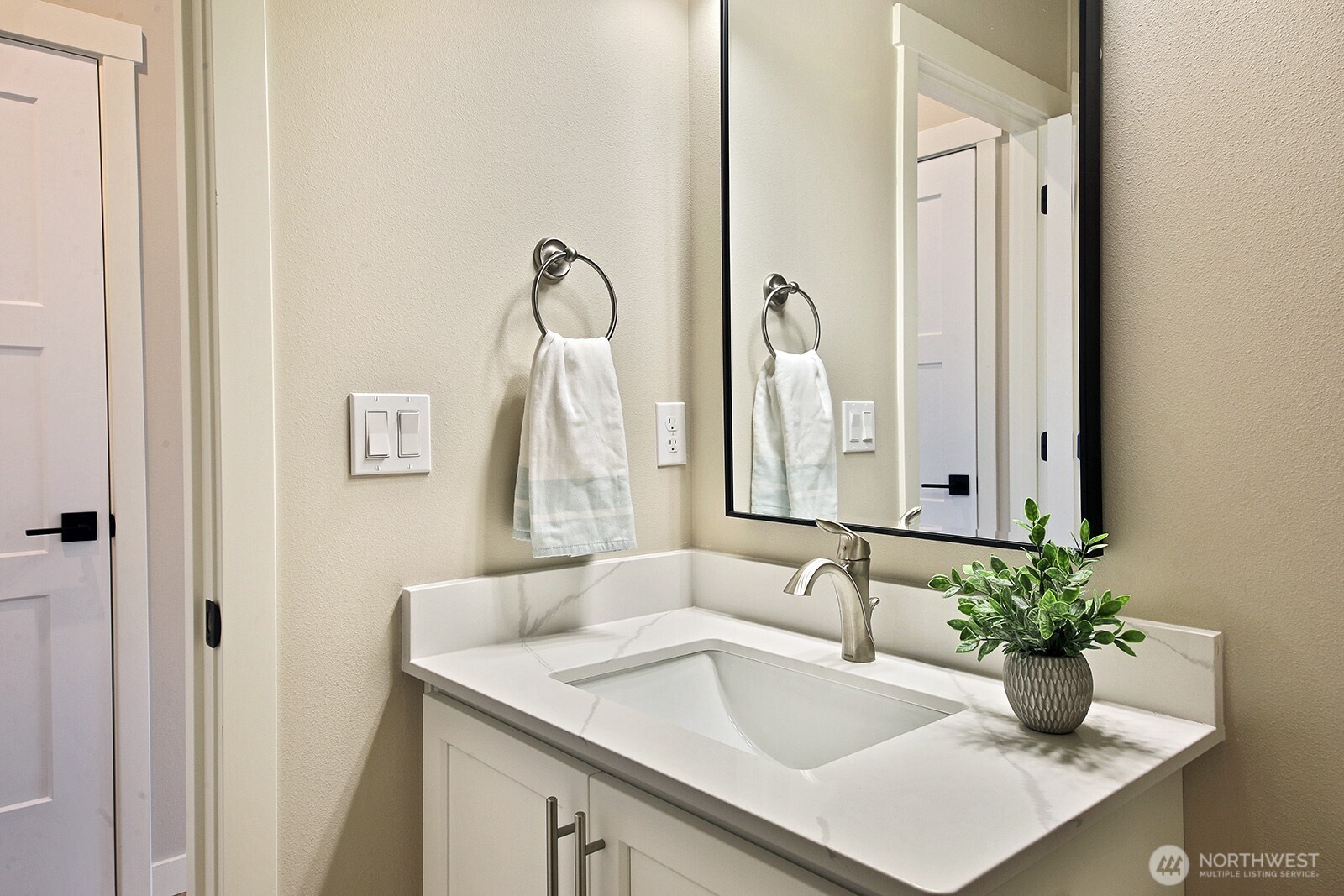 695 3rd Street, Unit A Langley, WA 98260 - Photo 14 of 28 a bathroom with a sink and a mirror
