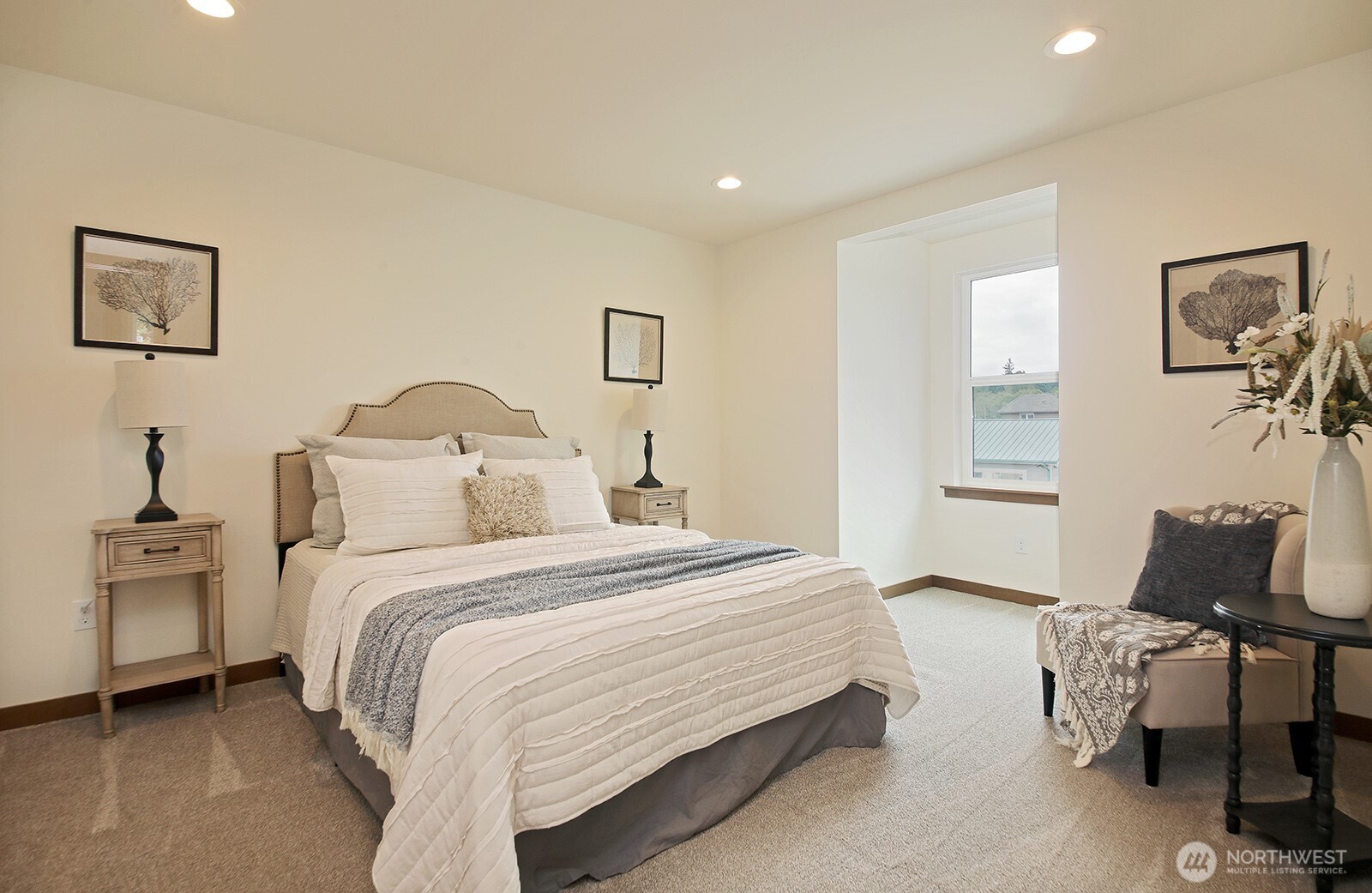 695 3rd Street, Unit A Langley, WA 98260 - Photo 17 of 28 a bedroom with a bed and chair